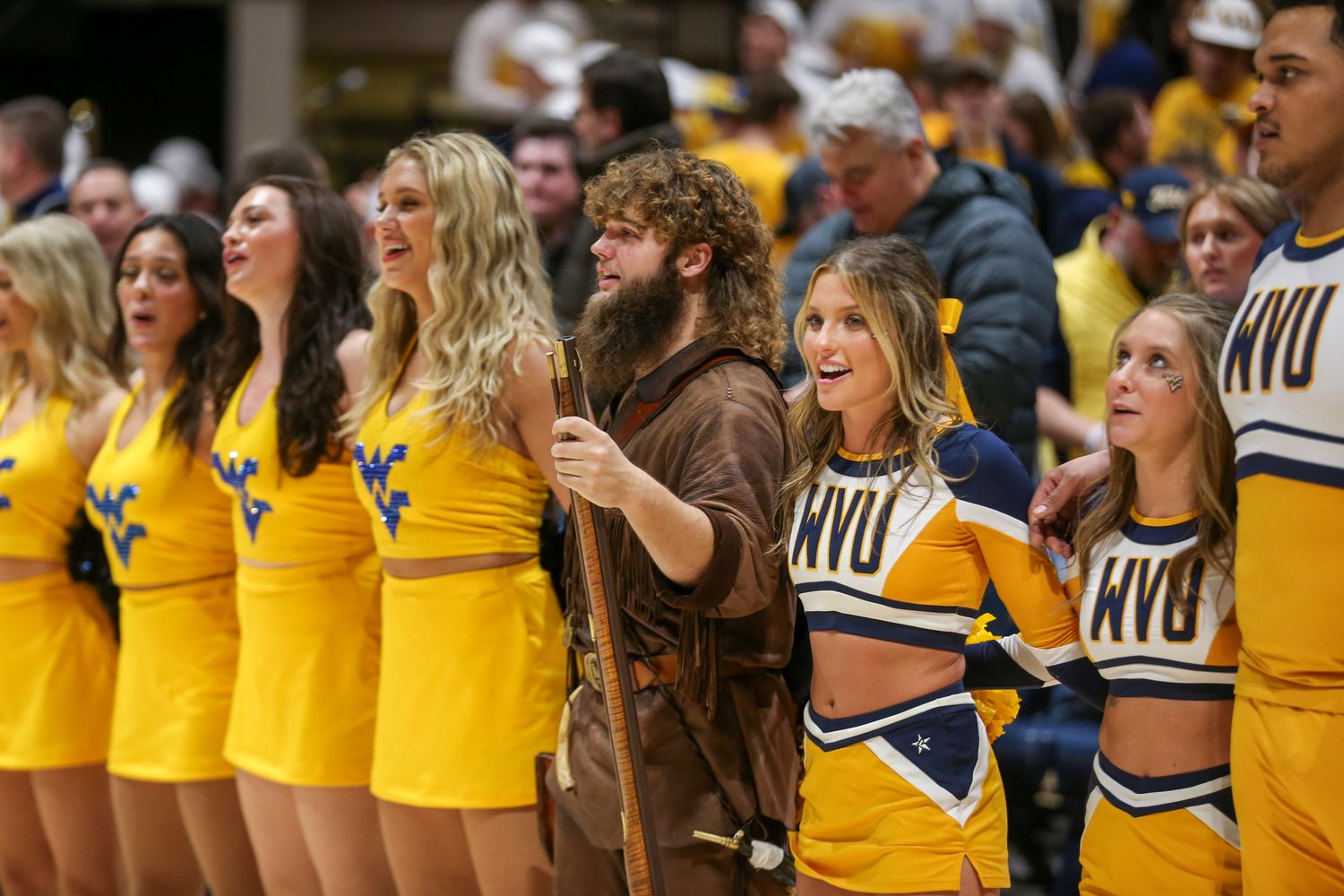 Jan 13, 2024; Morgantown, West Virginia, USA; The West Virginia Mountaineers mascot leads the fans in Country Roads after defeating the Texas Longhorns at WVU Coliseum. Mandatory Credit: Ben Queen-USA TODAY Sports  